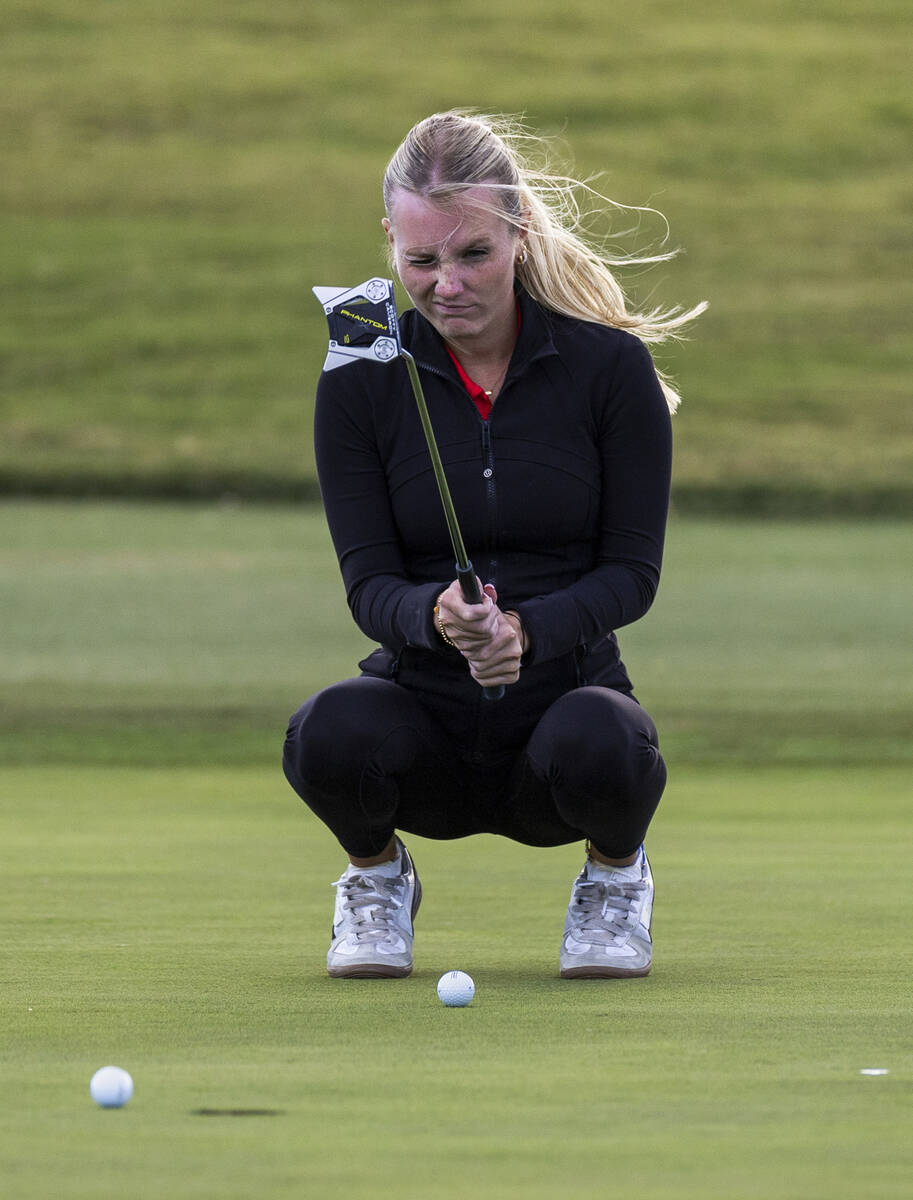 Coronado's Berlin Biddinger lines up a putt near the hole during the 5A girls golf state t ...