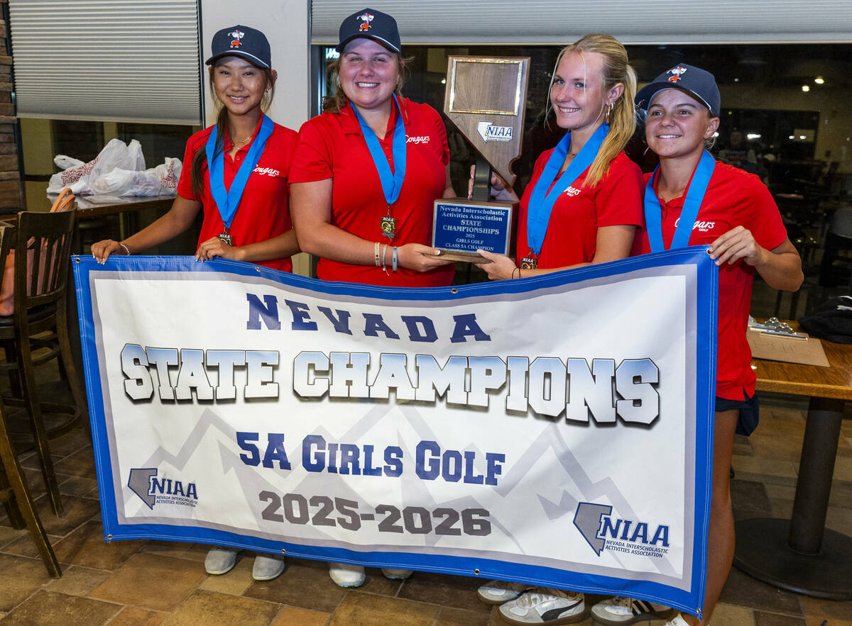 Golfers from Coronado win the team competition as gather with their trophy following the 5A gir ...