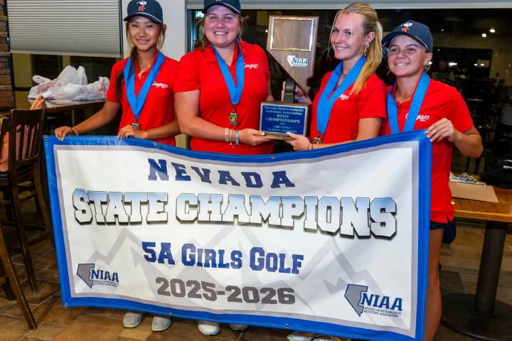 Golfers from Coronado win the team competition as gather with their trophy following the 5A gir ...