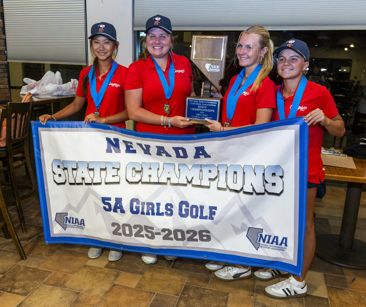 Golfers from Coronado win the team competition as gather with their trophy following the 5A gir ...