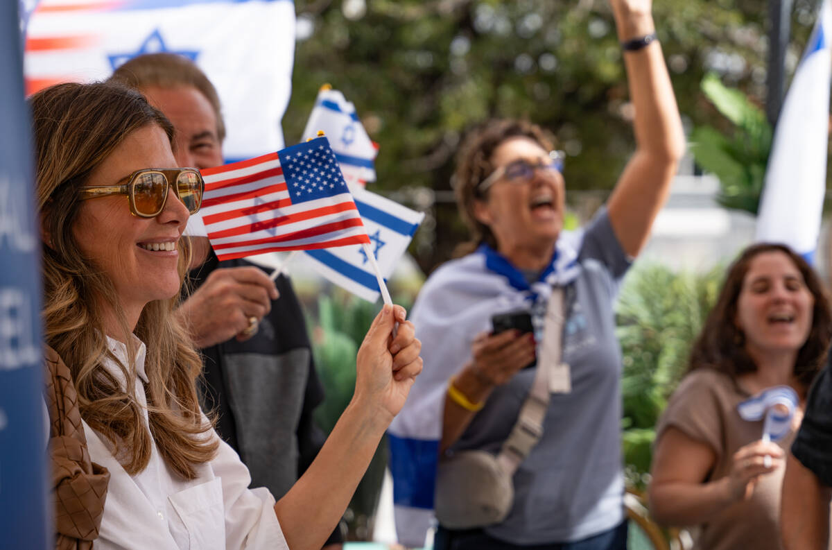 Community members dance and sign during a celebration hosted by the Israeli-American Council ma ...
