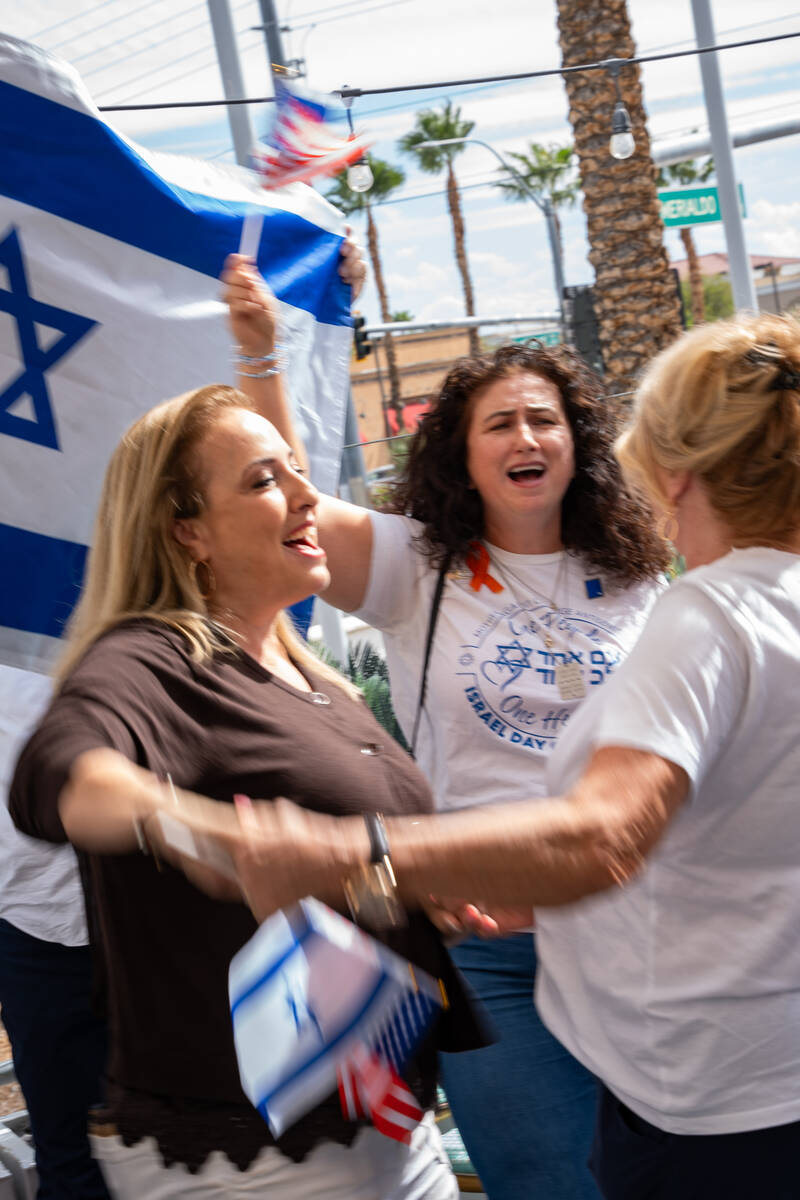 Community members dance and sign during a celebration hosted by the Israeli-American Council ma ...