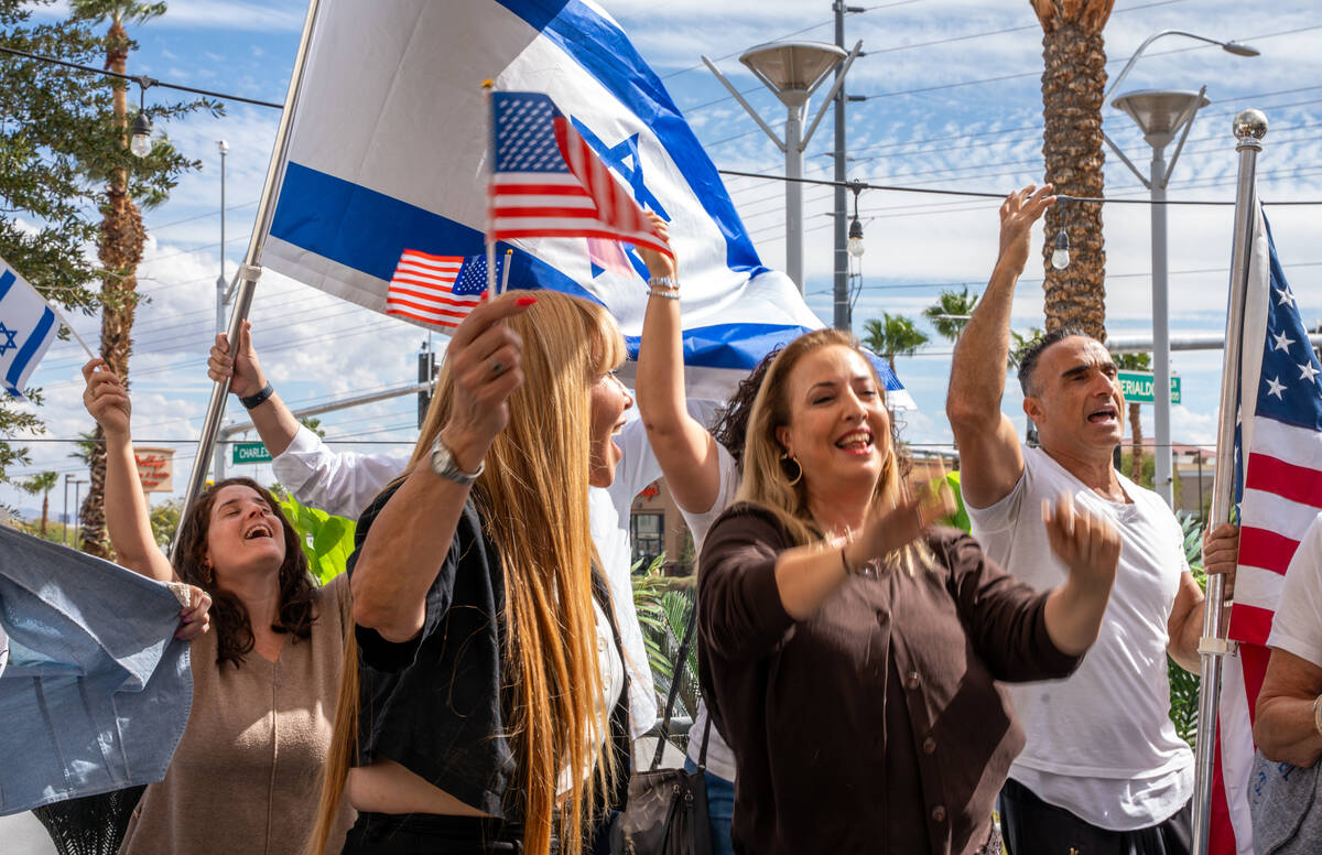 Community members dance and sign during a celebration hosted by the Israeli-American Council ma ...
