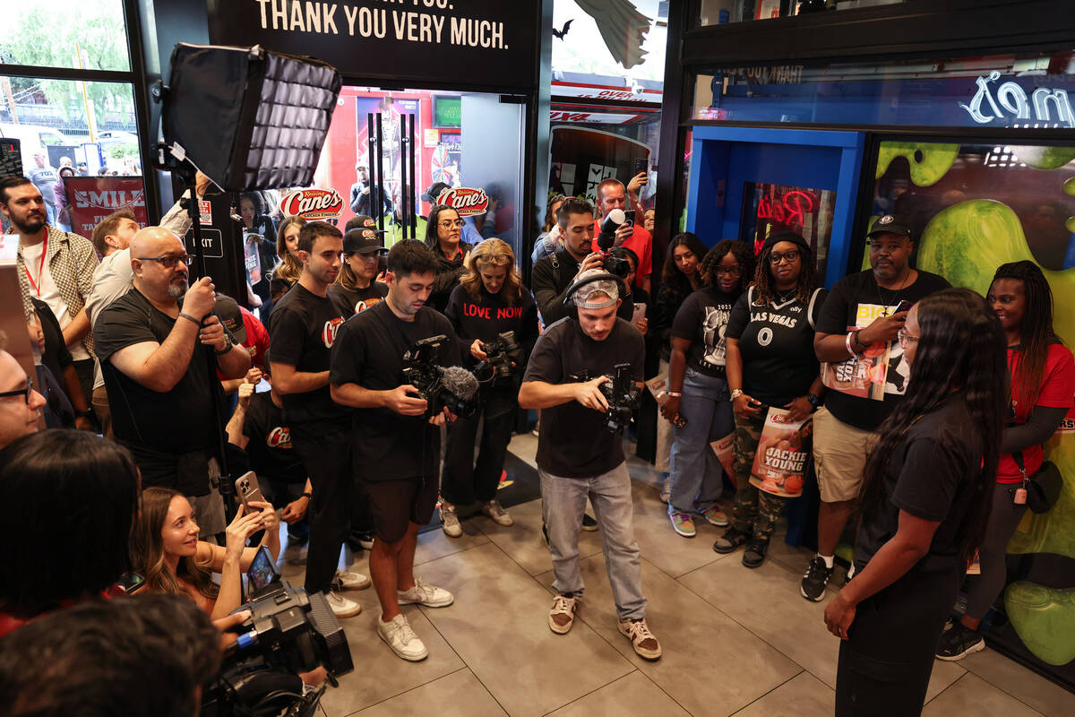 Aces guard Jackie Young interacts with the media at Raising Cane’s on the Strip Tuesday, ...