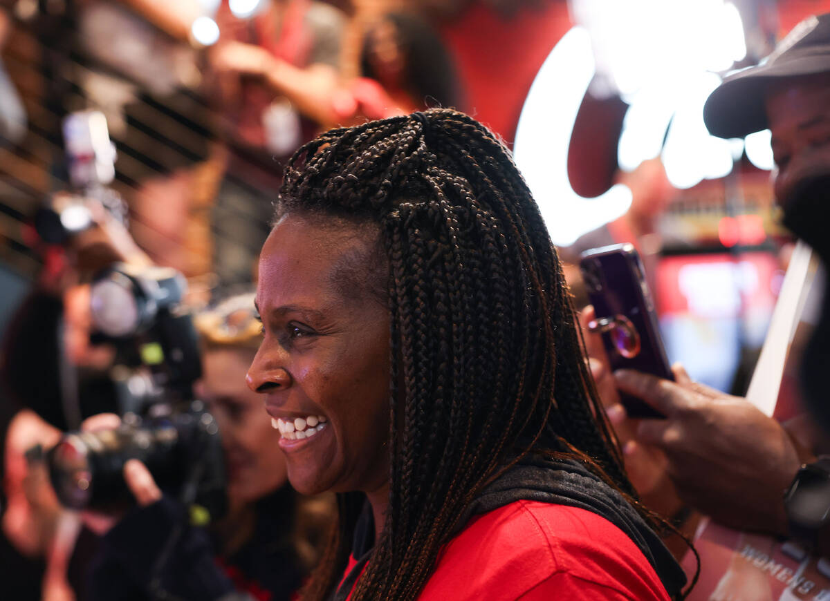 Aces guard Jackie Young greets fans at Raising Cane’s on the Strip Tuesday, Oct. 14, 202 ...