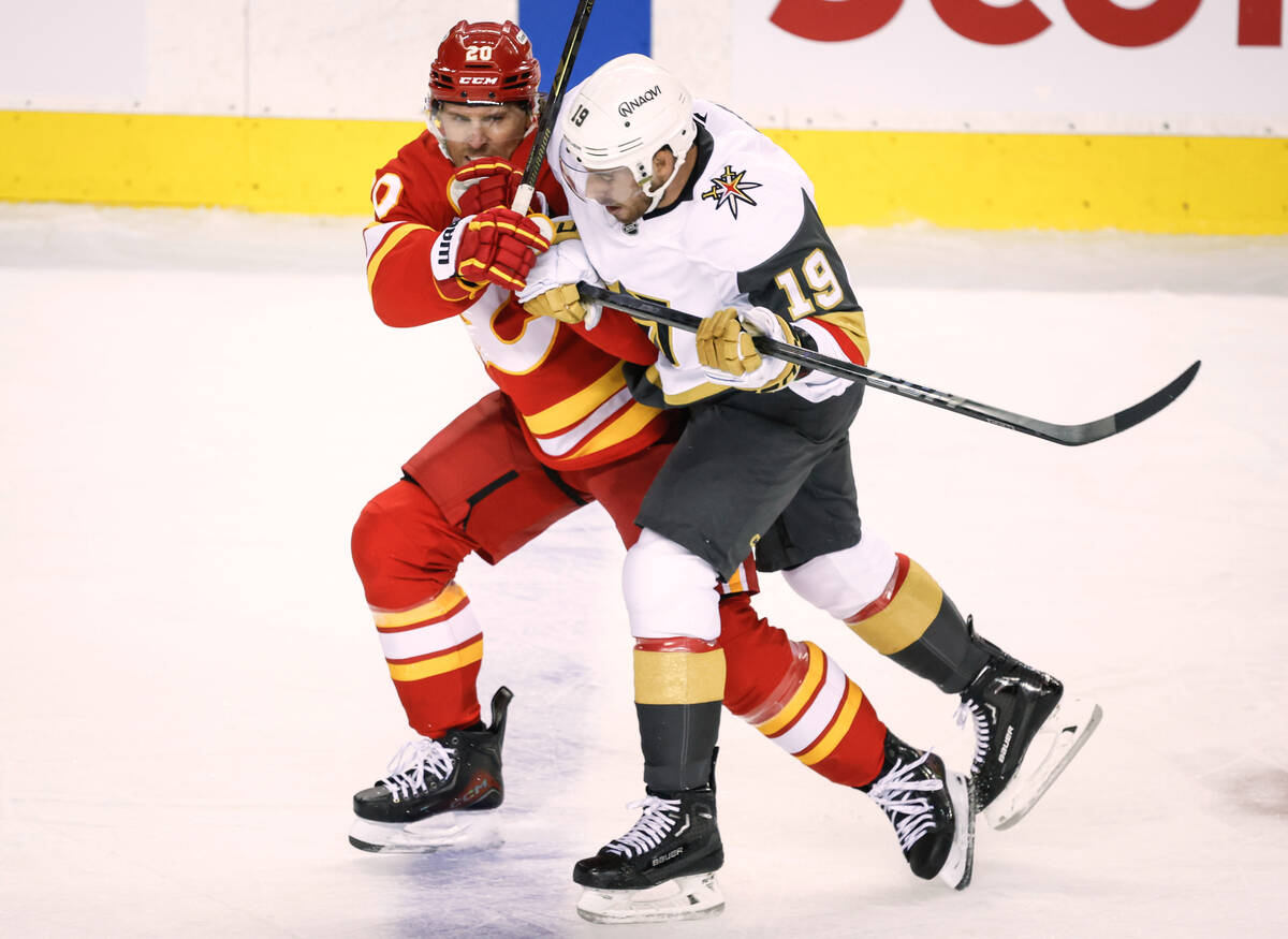 Vegas Golden Knights' Reilly Smith, right, checks Calgary Flames' Blake Coleman durin ...