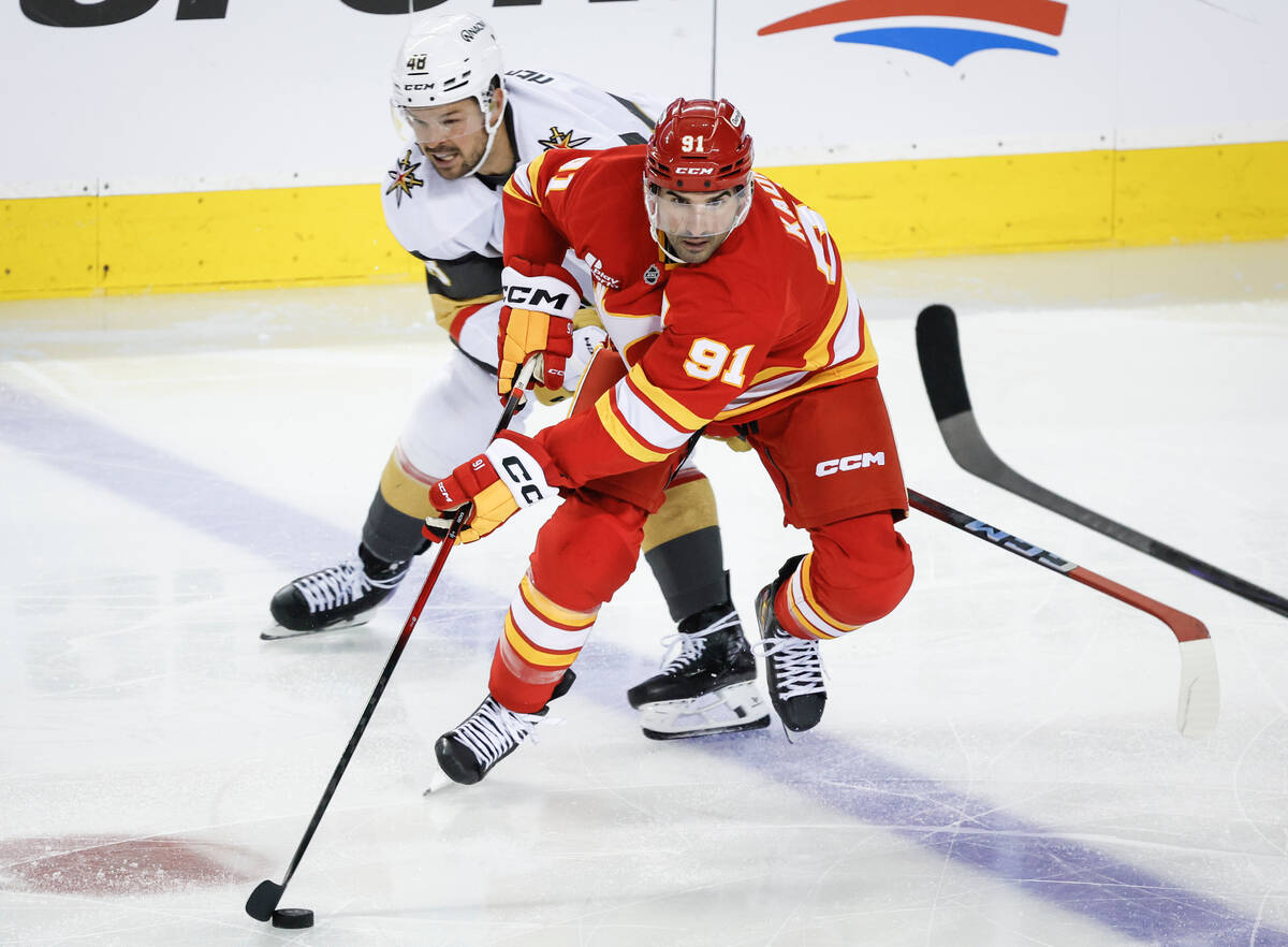 Vegas Golden Knights' Tomas Hertl, left, chases Calgary Flames' Nazem Kadri during th ...