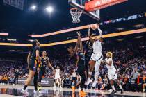 Aces center A'ja Wilson (22) leaps up for the ball during game four of a WNBA finals match ...