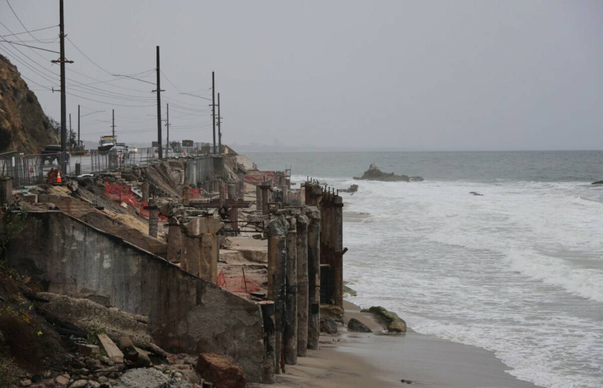 Beachfront properties damages by the Palisades Fire are shown during a storm on Tuesday, Oct. 1 ...