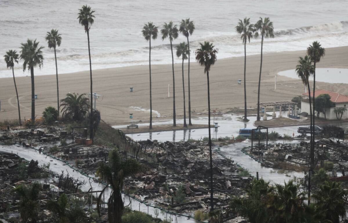 Rain comes down on a neighborhood in the Palisades Fire zone on Tuesday, Oct. 14, 2025, in the ...