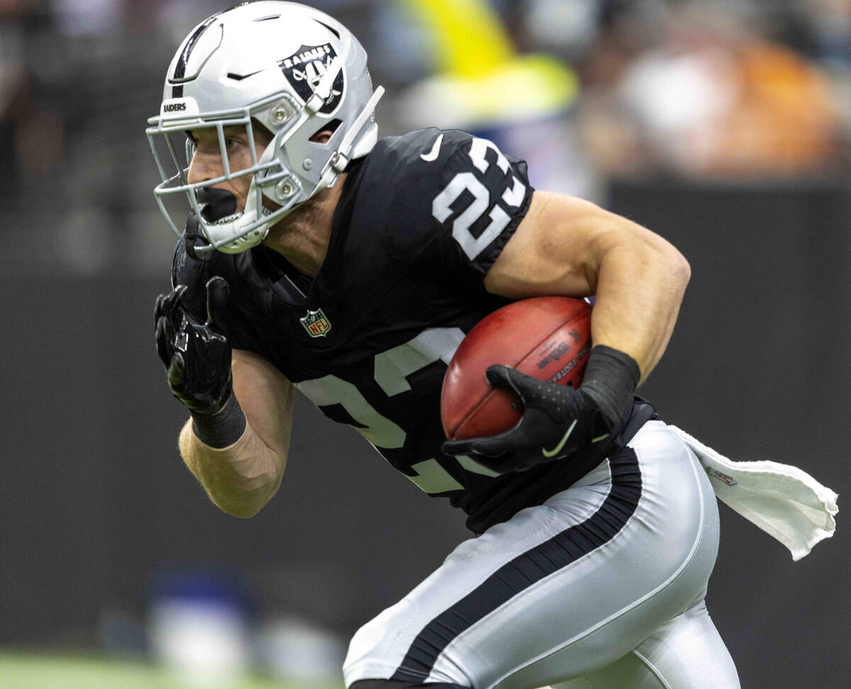 Raiders running back Dylan Laube (23) returns a kickoff during the second half of an NFL game a ...