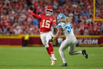 Kansas City Chiefs quarterback Patrick Mahomes (15) passes against Detroit Lions middle linebac ...