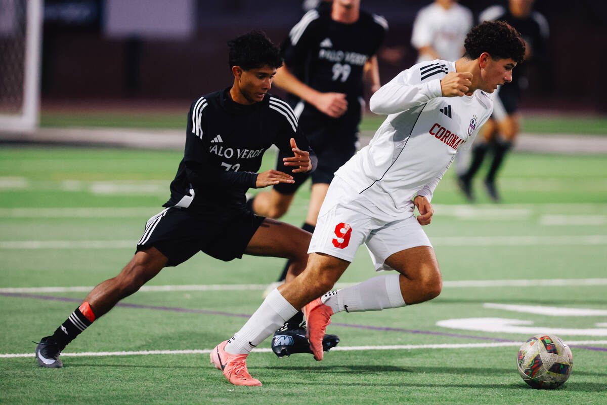 Coronado midfielder Dylan Flores (9) rushes the ball during a high school soccer game at Palo V ...