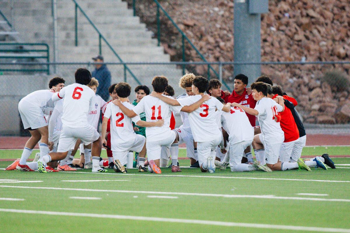 Coronado players kneel together before a high school soccer game at Palo Verde High School Wedn ...