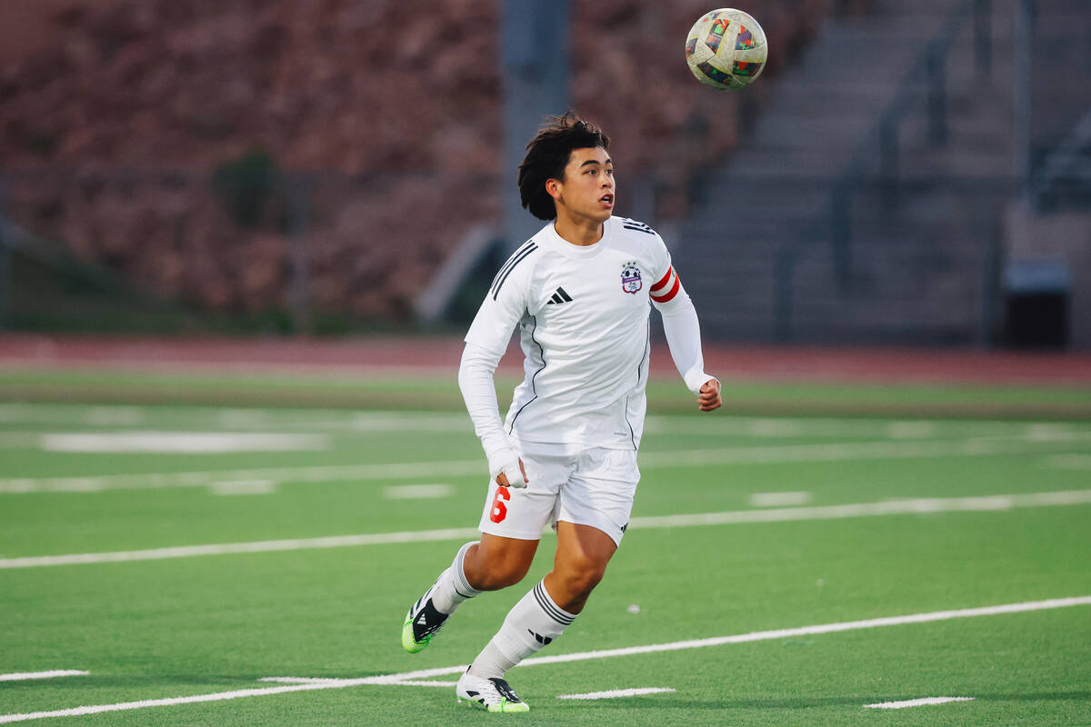 Coronado midfielder Cy Adams chases the ball during a high school soccer game at Palo Verde Hig ...