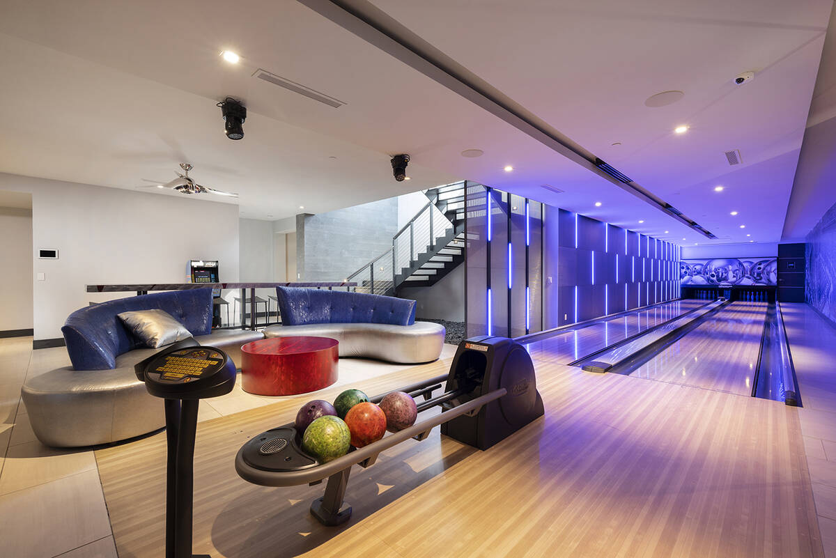 The MacDonald Highlands home has a private bowling alley with a bar on an entertainment level. ...