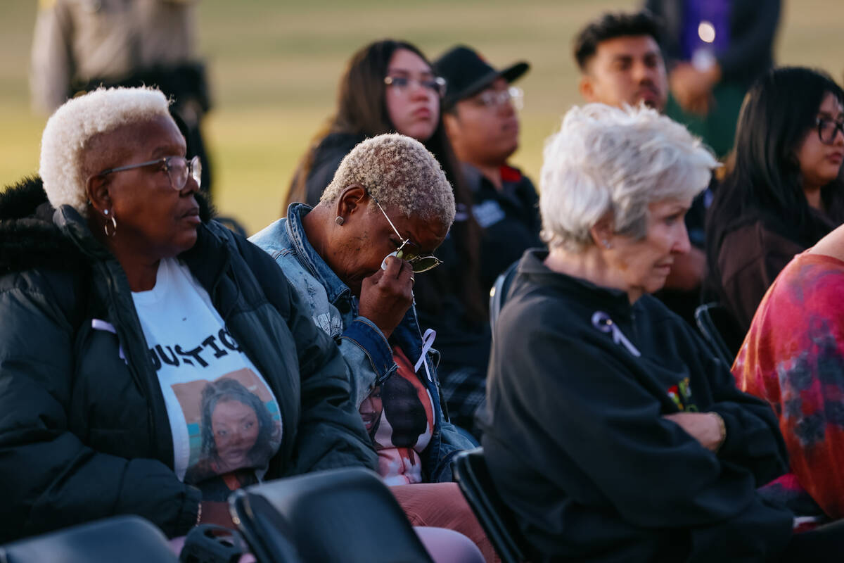 Teases Williams wipes away tears during a tree dedication in honor of domestic violence victims ...