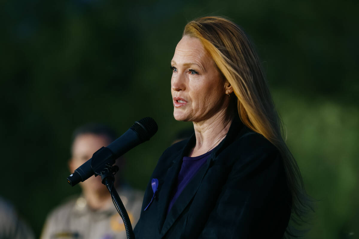 Tobhiyah Green, co-owner of Green Squared, speaks during a tree dedication in honor of domestic ...