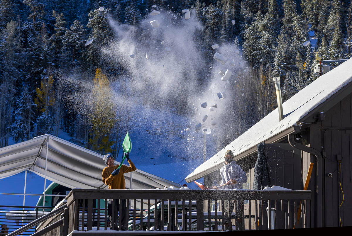 Lee Canyon's Brad Rubin, the terrain parks and trail crew manager, tosses shoveled snow of ...