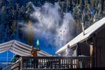 Lee Canyon's Brad Rubin, the terrain parks and trail crew manager, tosses shoveled snow of ...