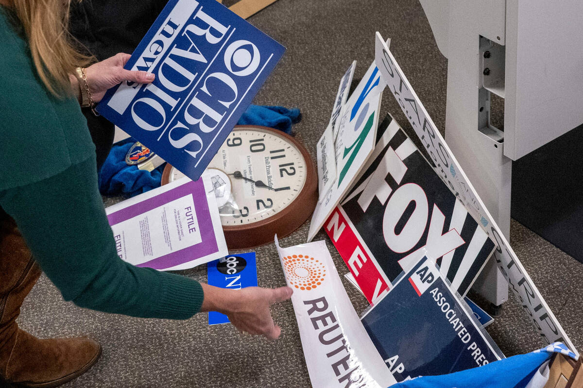 Washington Post reporter Tara Copp saves the name plaques from various news organizations as sh ...