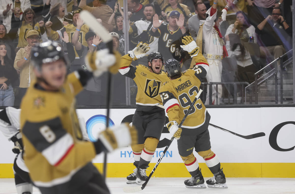 Golden Knights left wing Ivan Barbashev (49) and right wing Mitch Marner (93) celebrate a goal ...