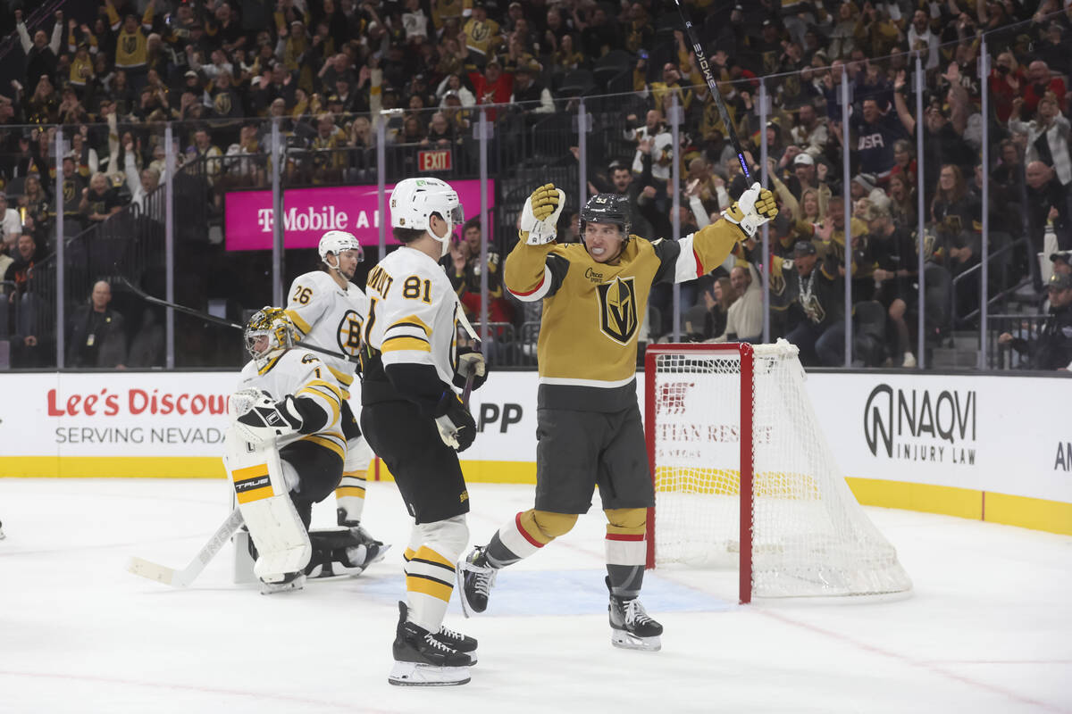 Golden Knights right wing Mitch Marner (93) celebrates a goal by Golden Knights left wing Cole ...