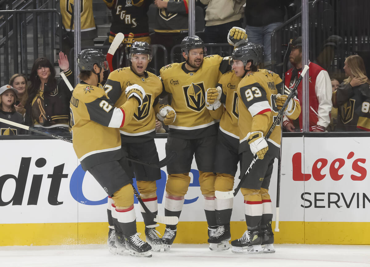 The Golden Knights celebrate a goal by Golden Knights right wing Pavel Dorofeyev, obscured, dur ...