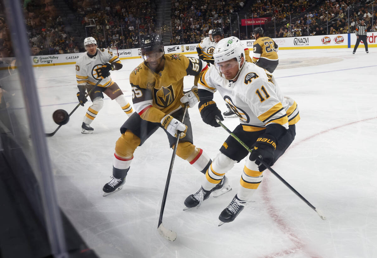 Golden Knights right wing Keegan Kolesar (55) and Boston Bruins center Casey Mittelstadt (11) e ...