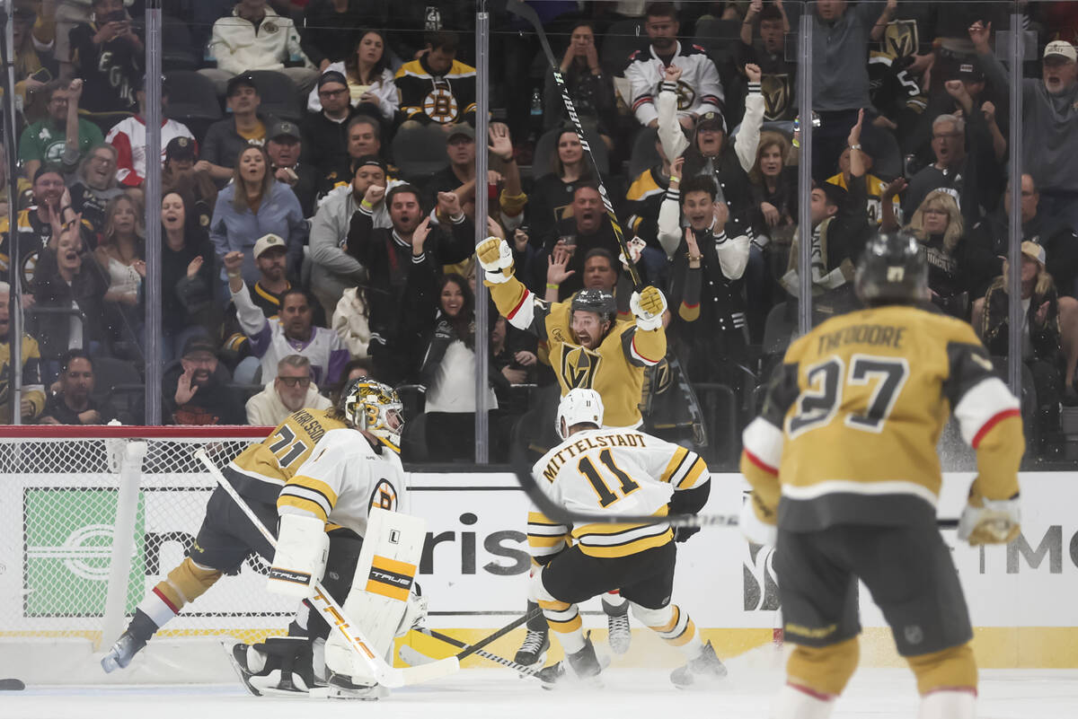 Golden Knights right wing Mark Stone (61) celebrates a goal by Golden Knights center William Ka ...
