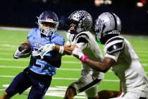 Centennial wide receiver Jordan Bostick (2) rushes against Palo Verde wide receiver Leo Templet ...