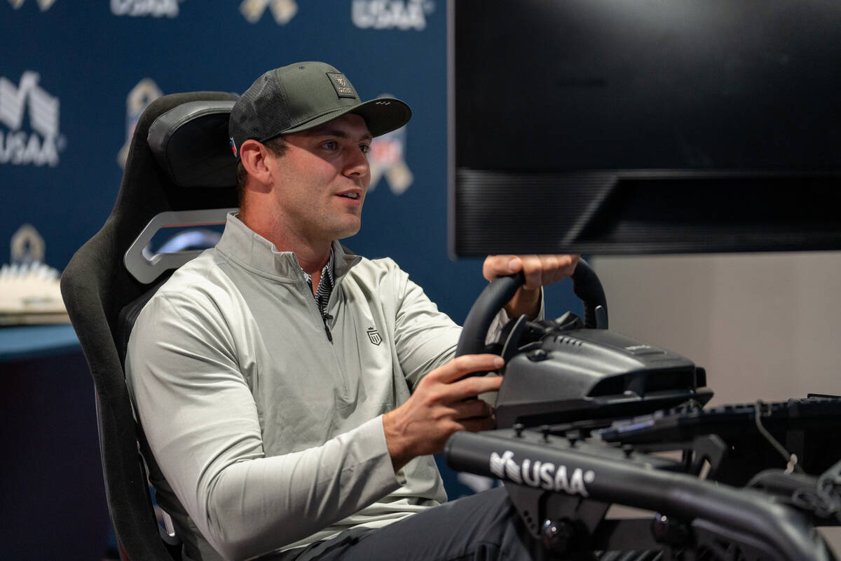 Raiders tight end Brock Bowers, in partnership with USAA, tests an impaired driving simulator t ...