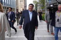 Illinois Governor JB Pritzker walks to River Point Park for a news conference, Aug. 25, 2025, i ...