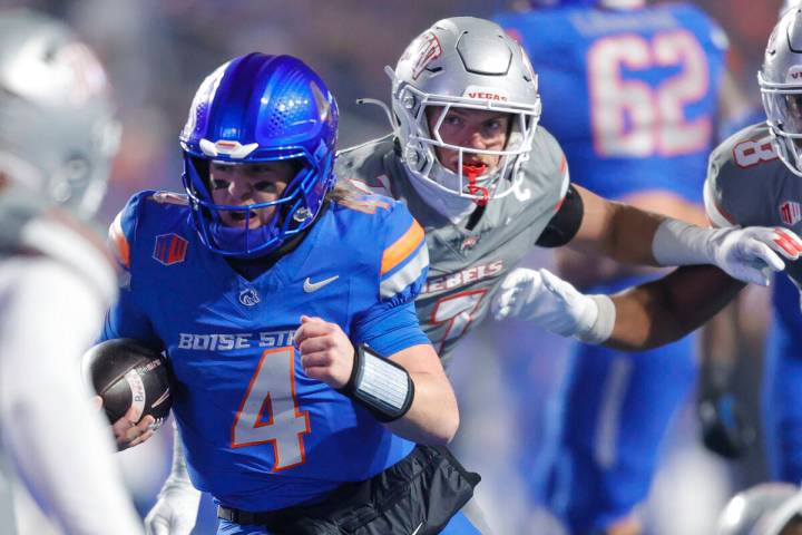 Boise State quarterback Maddux Madsen (4) runs through the UNLV defense on a touchdown run in t ...