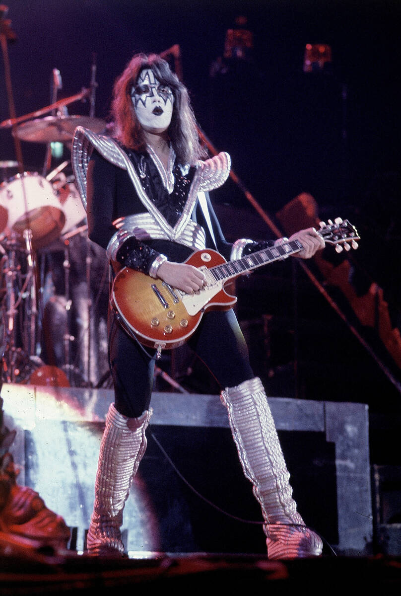 FILE - Ace Frehley, lead guitarist for the hard-rock glam band KISS, performs with a Les Paul g ...