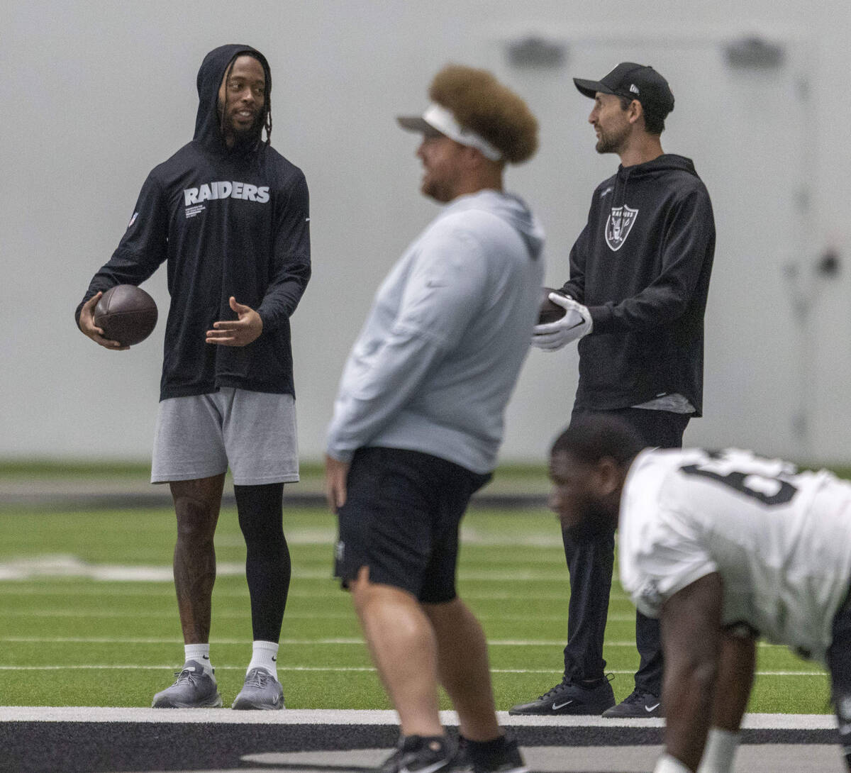 Raiders assistant quarterbacks coach/game management coach Nate Carroll, right, and wide receiv ...