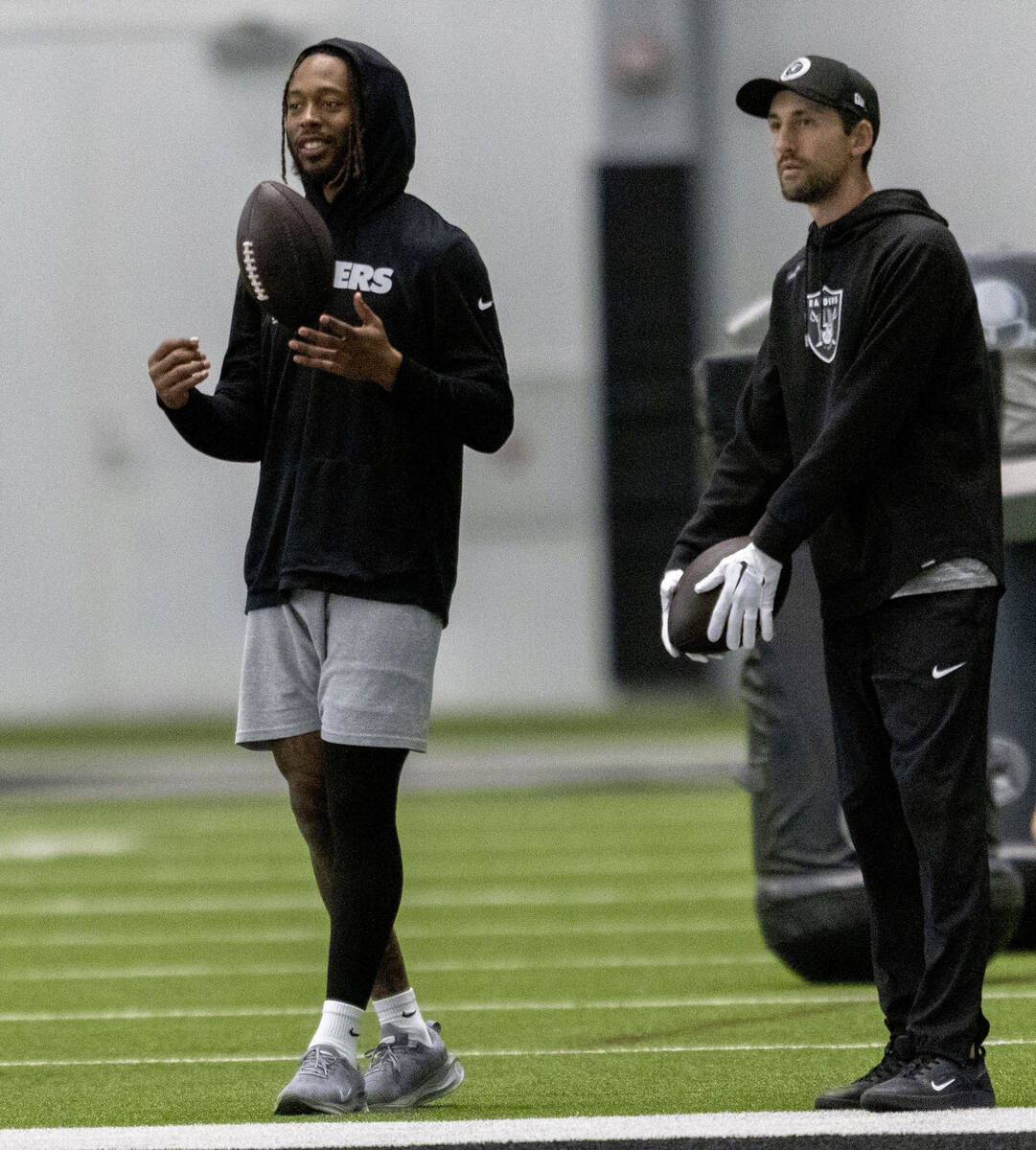 Raiders assistant quarterbacks coach/game management coach Nate Carroll, right, and wide receiv ...