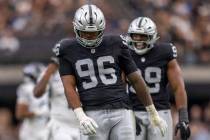 Raiders defensive tackle Jonah Laulu (96) dances to celebrate his sack of Tennessee Titans quar ...