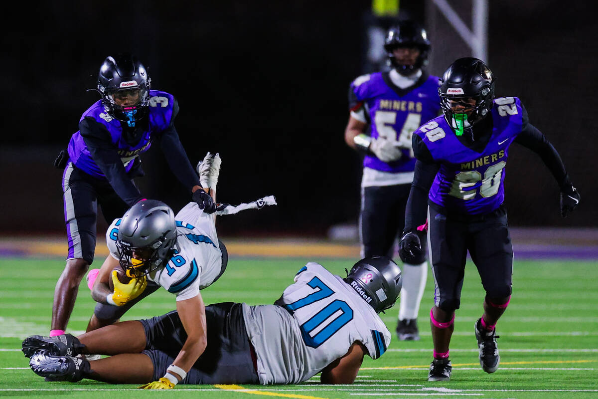Silverado wide receiver Jayden Luangrath (16) goes down with the ball during a football game be ...