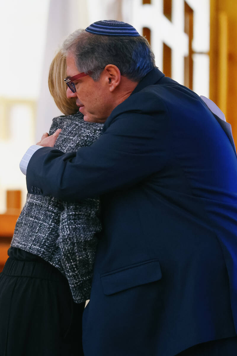 Rabbi Felipe Goodman of Temple Beth Sholom hugs Congresswoman Susie Lee, R-Las Vegas, during an ...