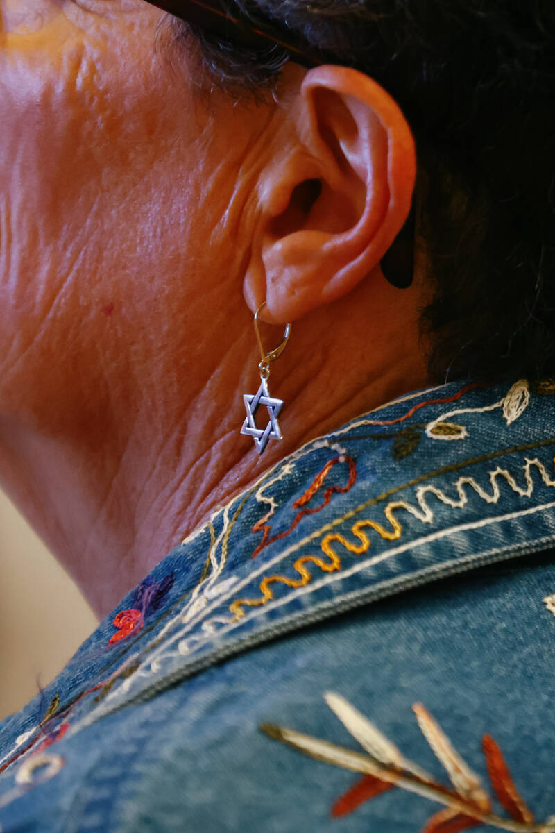A Star of David earring dangles from the ear of an attendee during an October 7 attacks remembr ...