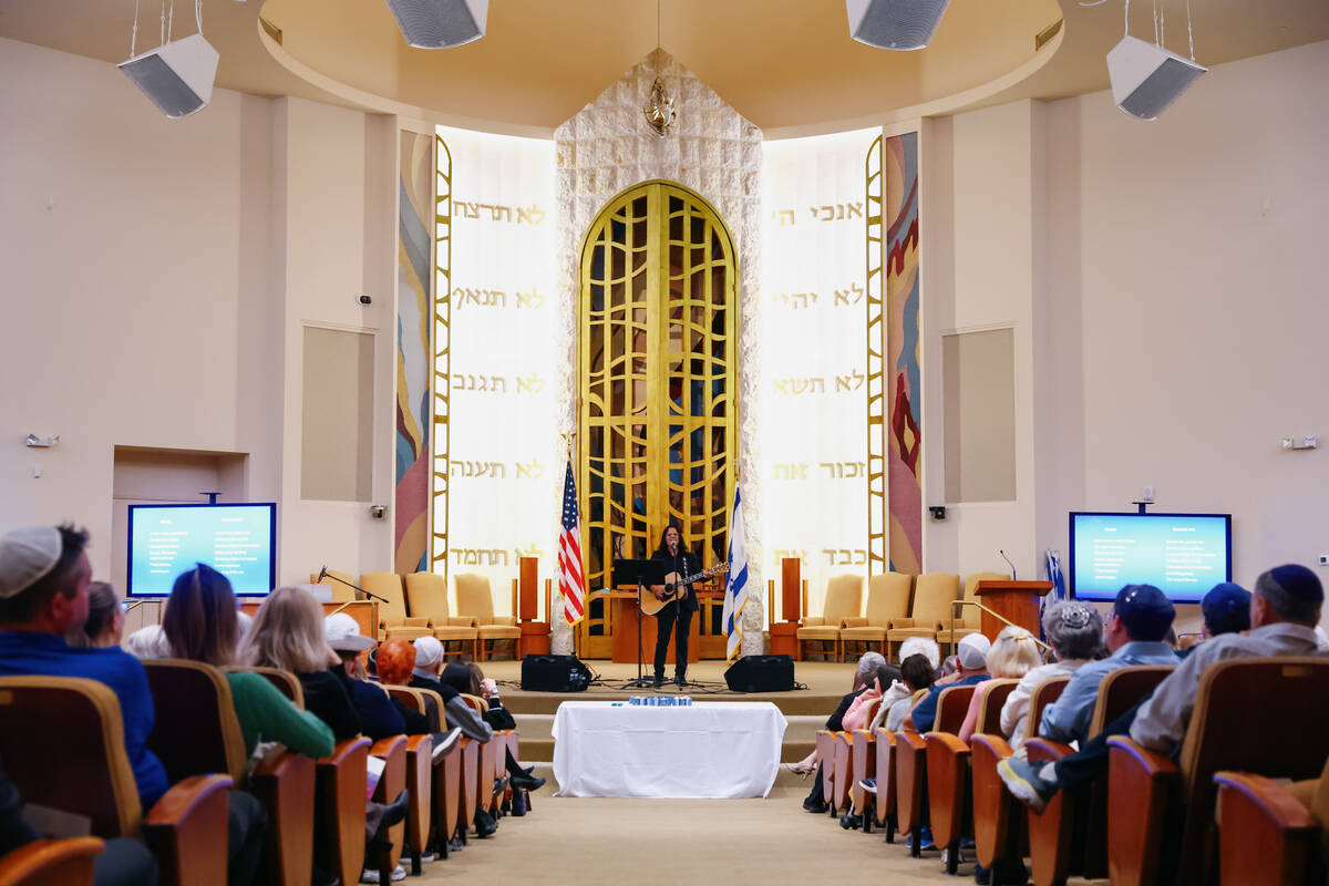 Micha Biton performs his music during an October 7 attacks remembrance event on Thursday, Oct. ...