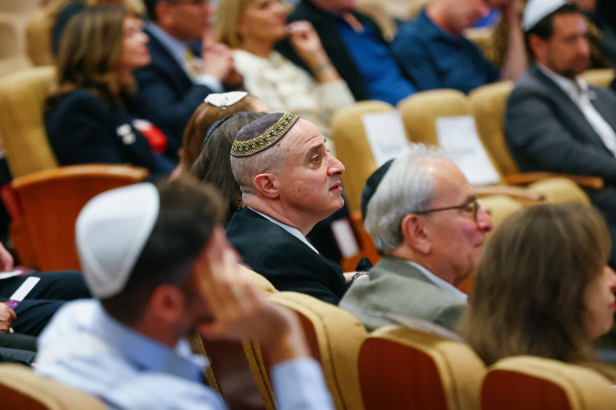 Cantor David Perper, of Temple Sinai, listens to Micha Biton sing John Lennon’s “ ...