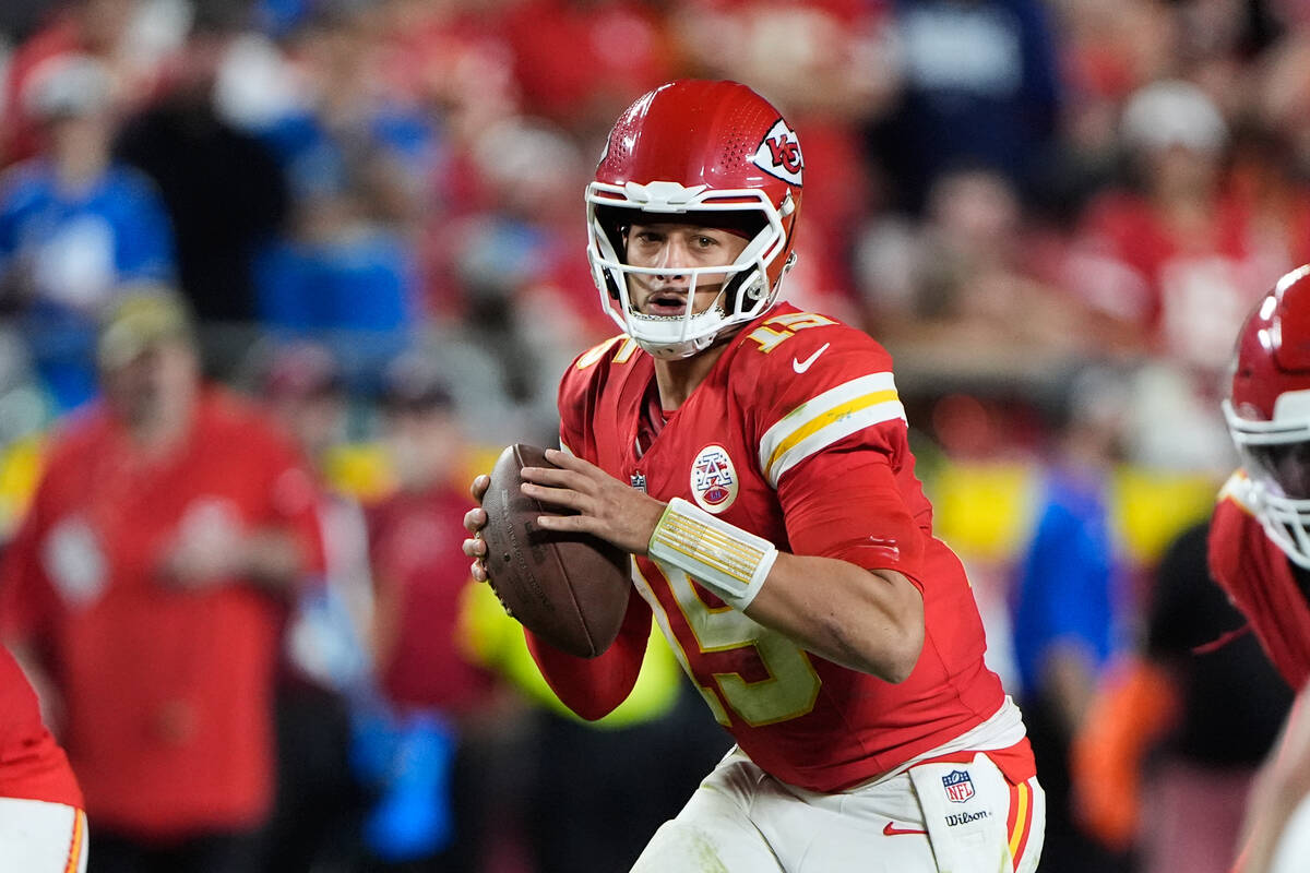 Kansas City Chiefs quarterback Patrick Mahomes looks to pass during the second half of an NFL f ...
