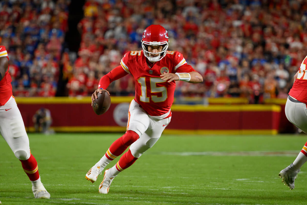 Kansas City Chiefs quarterback Patrick Mahomes scrambles against the Detroit Lions during the f ...