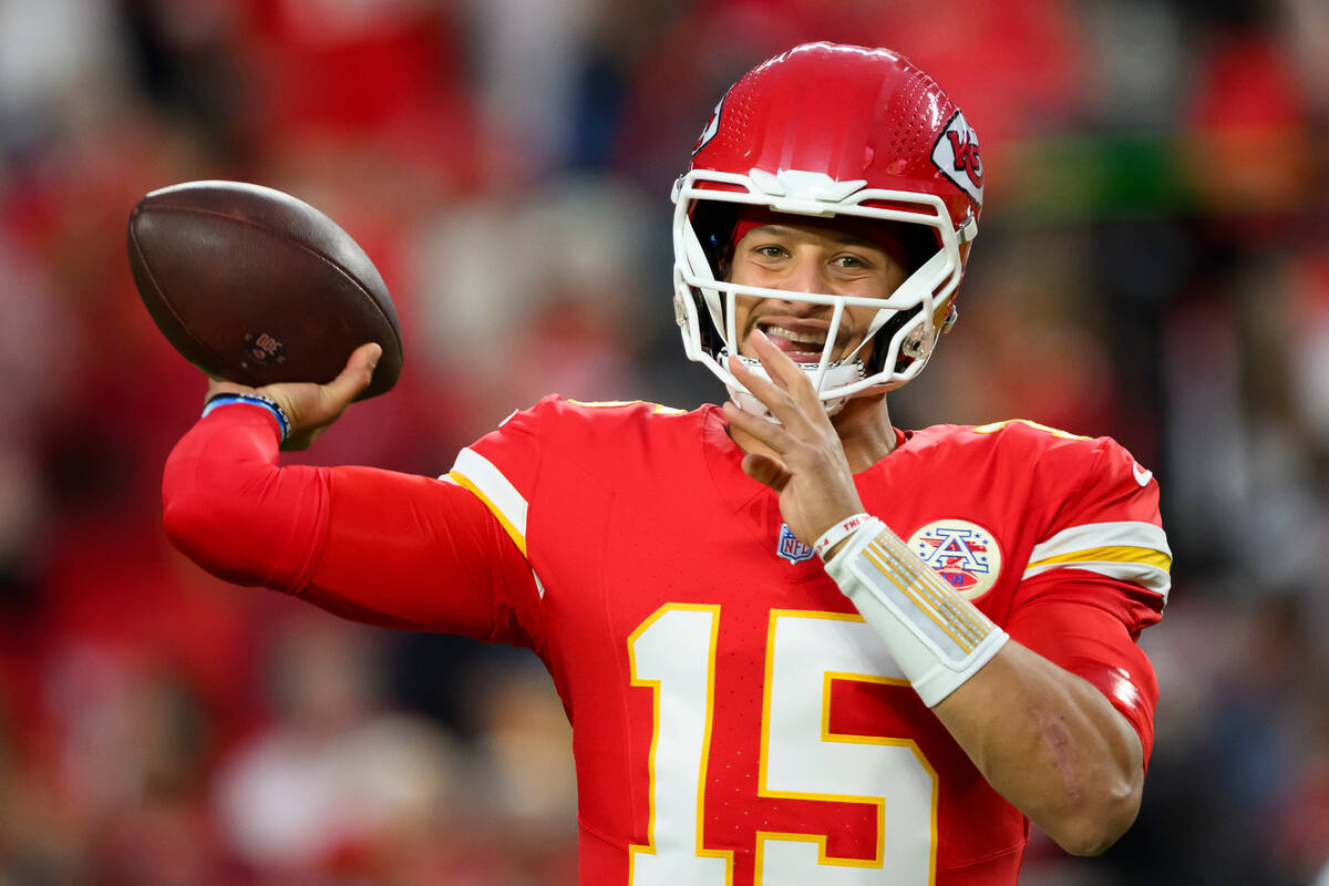 Kansas City Chiefs quarterback Patrick Mahomes throws during warmups before an NFL football gam ...