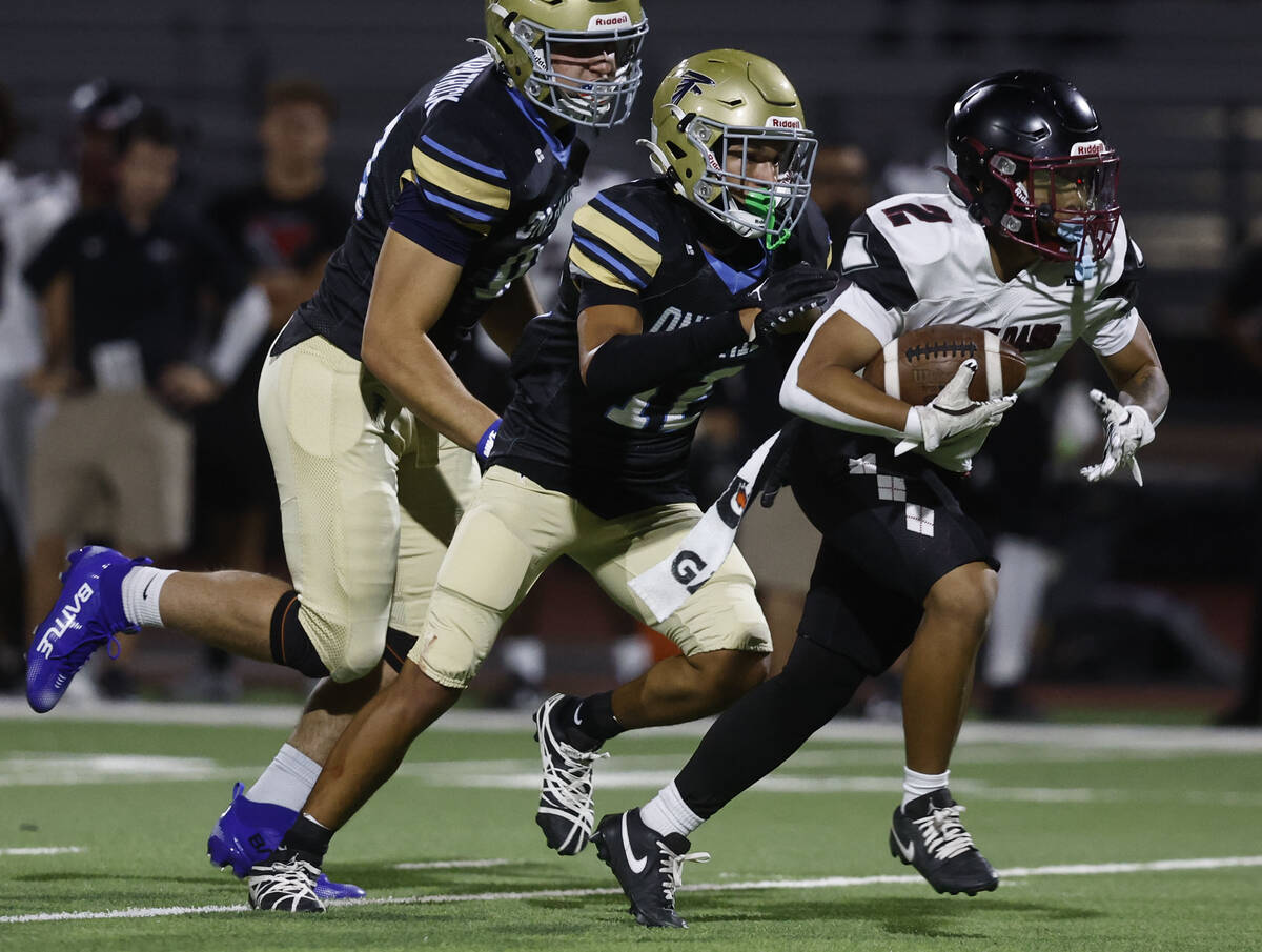 Desert Oasis running back Brycen Rabago (2) runs past Foothill defensive lineman Grant Kirkpatr ...