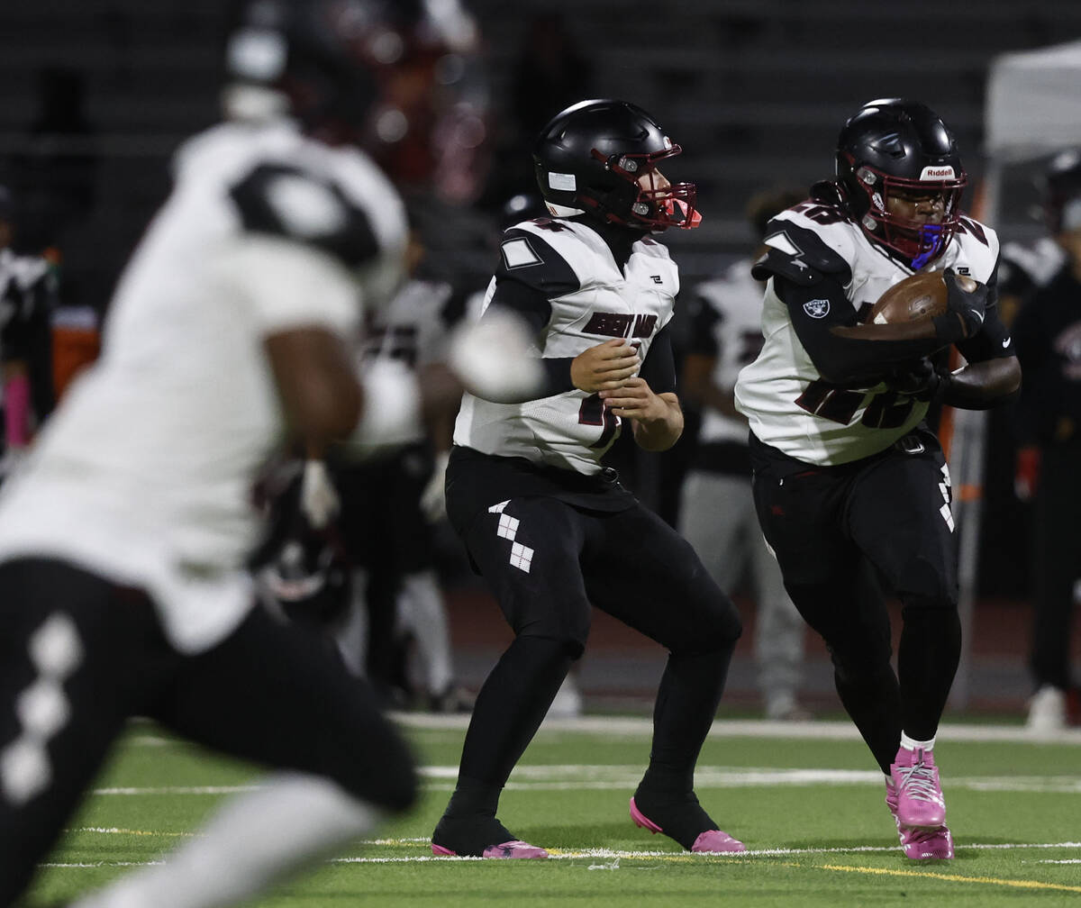 Desert Oasis running back Kyair Thomas (28) takes the hand off in the first half during their m ...