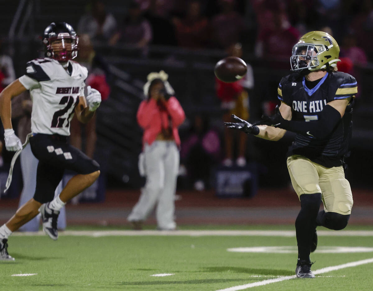 Foothill wide receiver Braxton Bonnett (5) makes the go-ahead touchdown catch and run past Dese ...