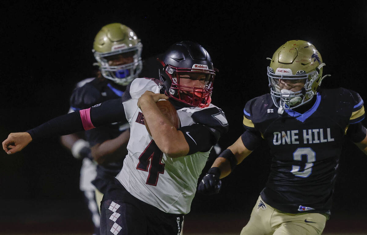 Desert Oasis quarterback Vincent Hales (4) scrambles past Foothill linebacker Taevin Phillips ( ...